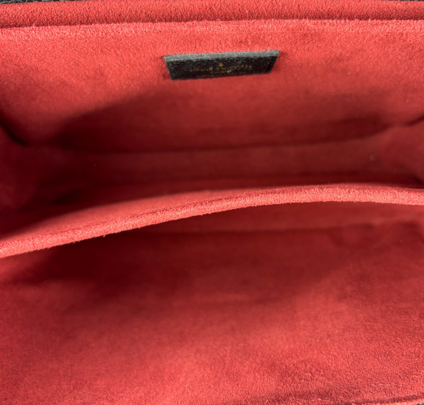 Metis clutch bag