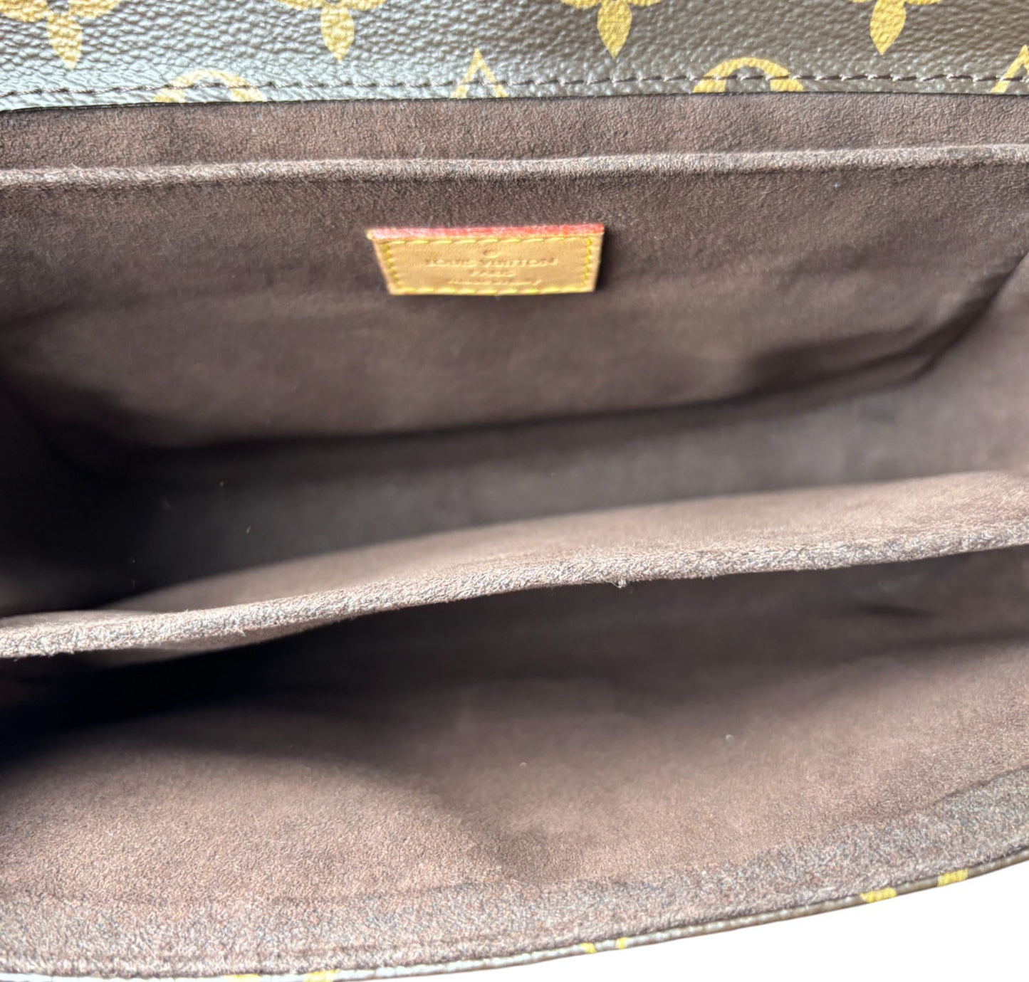 Metis Monogram Clutch