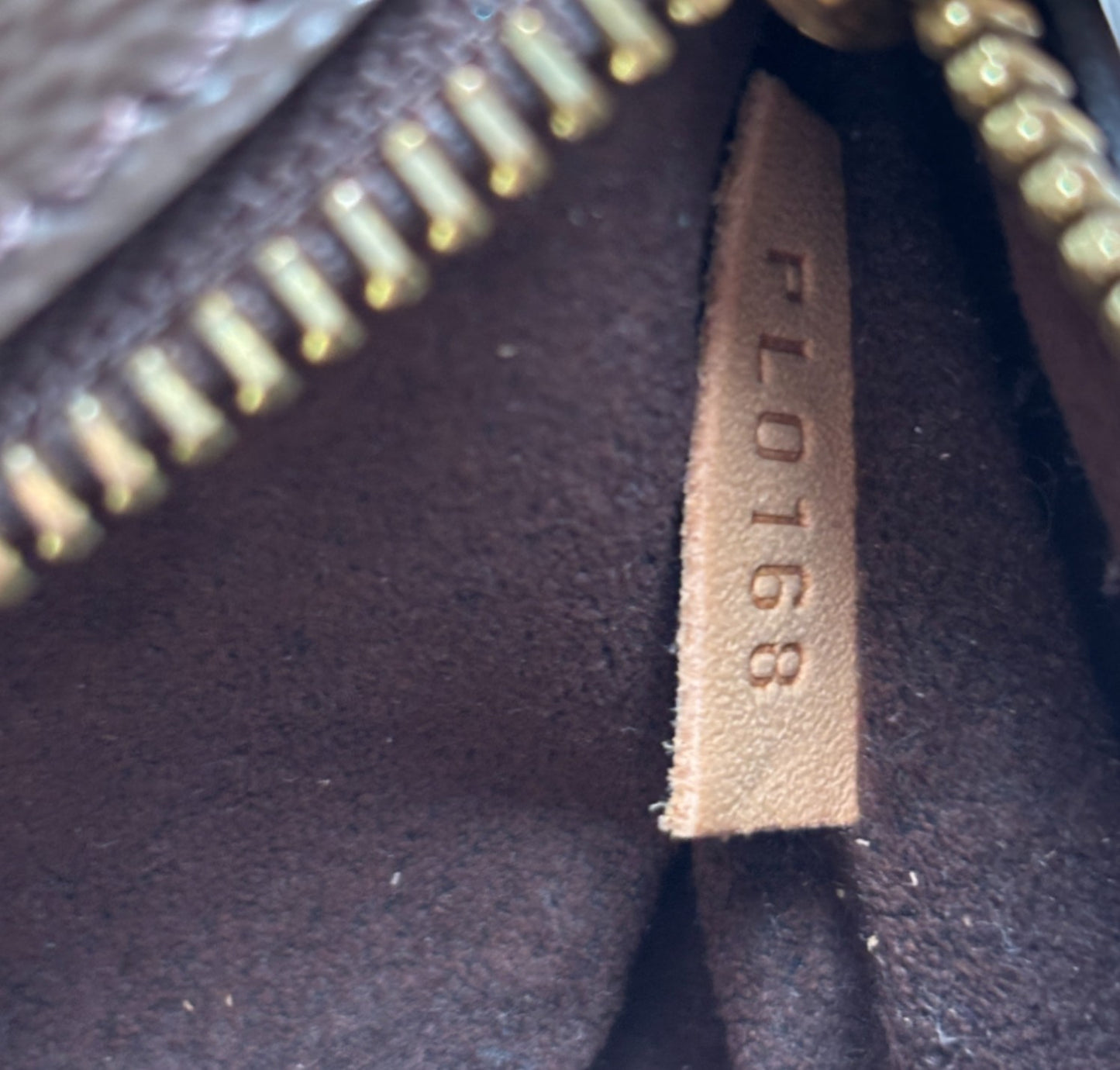 Metis Monogram Clutch