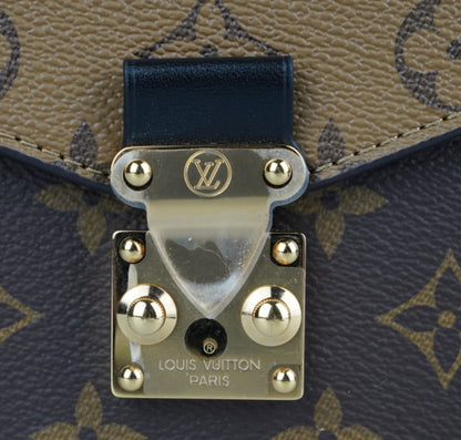 Métis Monogram Reverse clutch bag