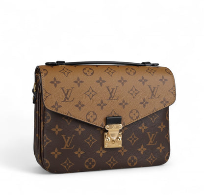 Métis Monogram Reverse clutch bag