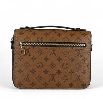 Métis Monogram Reverse clutch bag