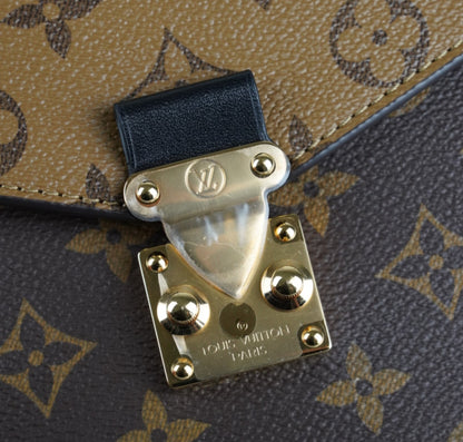 Métis Monogram Reverse clutch bag