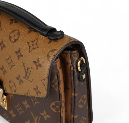 Métis Monogram Reverse clutch bag