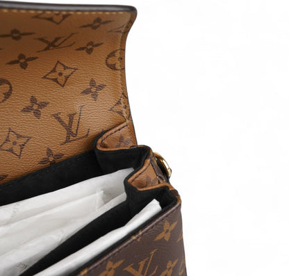 Métis Monogram Reverse clutch bag