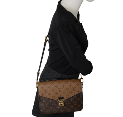 Métis Monogram Reverse clutch bag