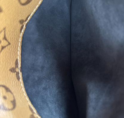 Métis Monogram Reverse clutch bag