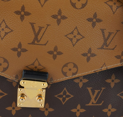 Métis Monogram Reverse clutch bag