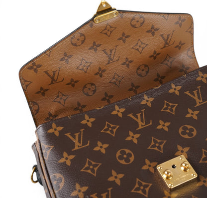 Métis Monogram Reverse clutch bag