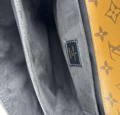 Métis Monogram Reverse clutch bag